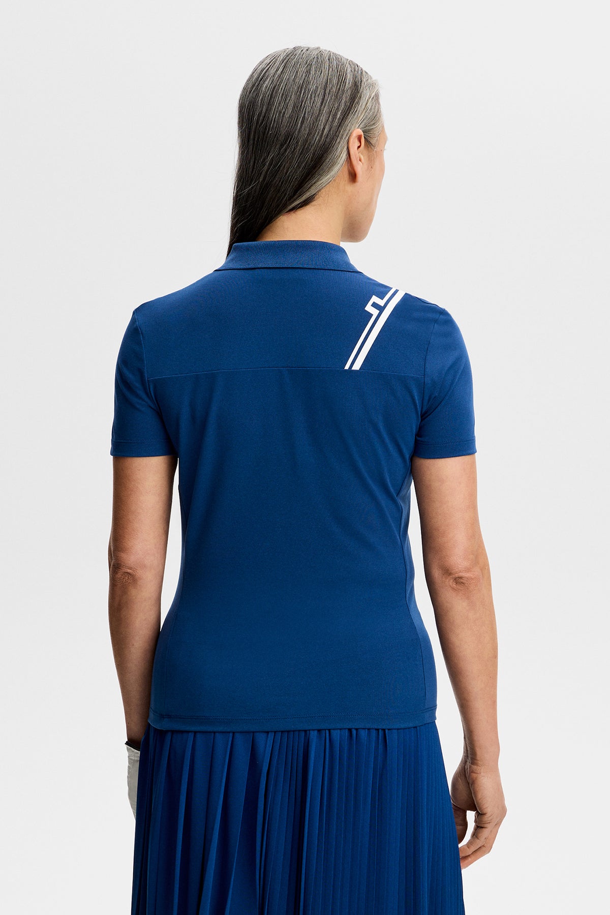 J.Lindeberg Melli Polo Estate Blue - livsstilsbild på banan
