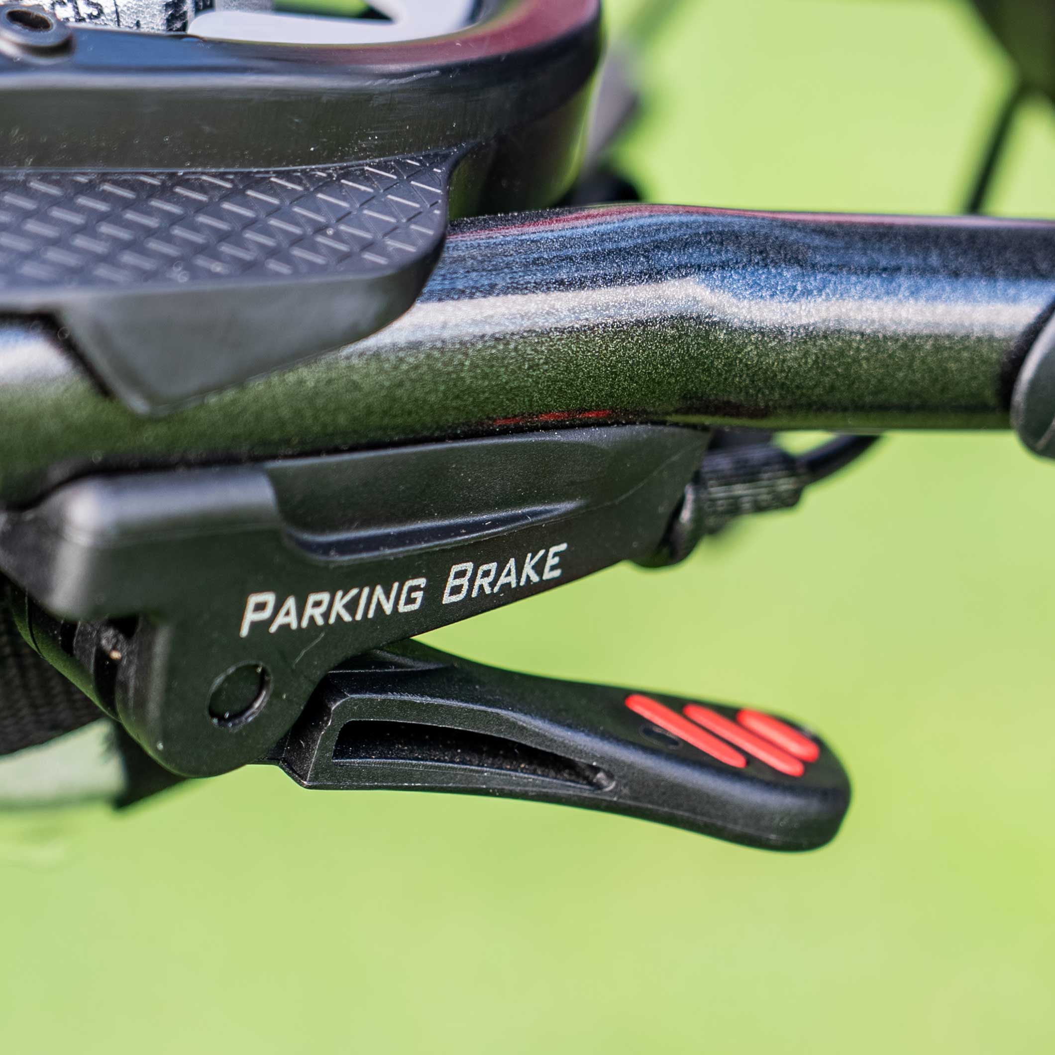 Bag Boy Slimfold handle-mounted parking brake detail