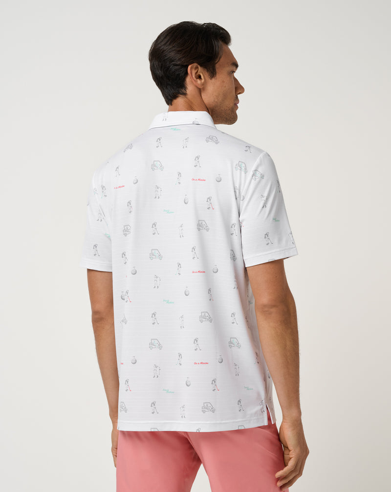 Travis Mathew On A Mission Polo – detalj av randig perforering och astronautgrafik