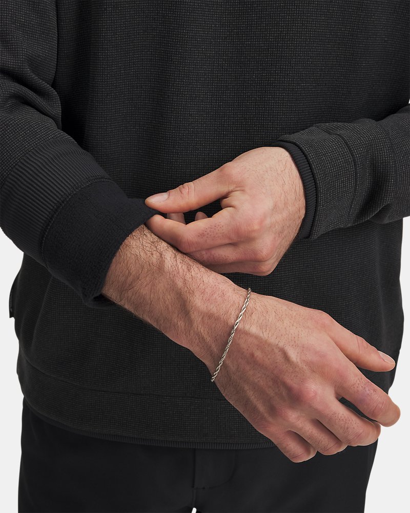 UA SweaterFleece tygdetalj – rutnätsstruktur och borstad insida